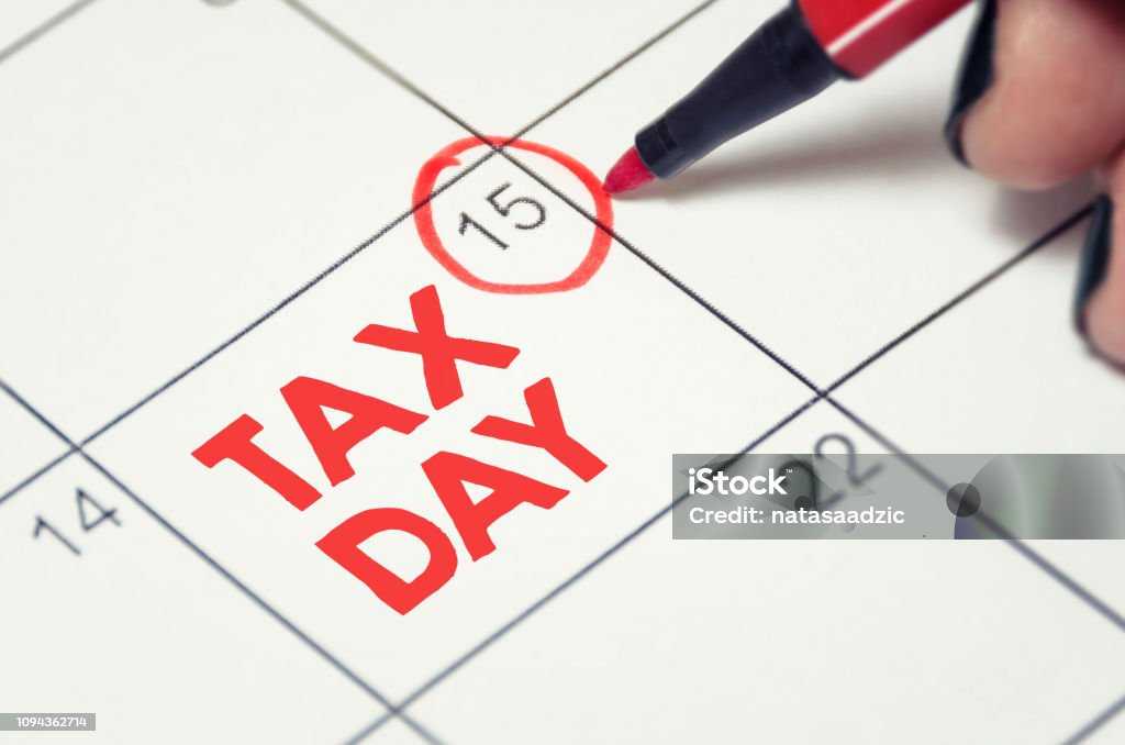 Tax Day Tax day concept. The USA tax due date marked on the calendar. Tax Form Stock Photo