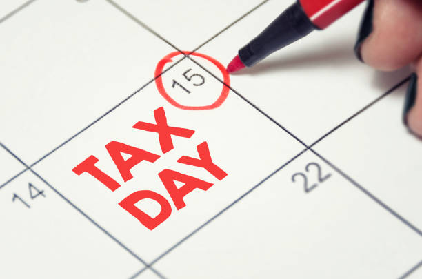 Tax Day Tax day concept. The USA tax due date marked on the calendar. april stock pictures, royalty-free photos & images