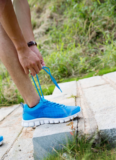 sporty blue sneakers. shoes on blue background. shoe store. shopping concept. footwear for training. athletic footgear for running. pair of comfortable sport shoes.
