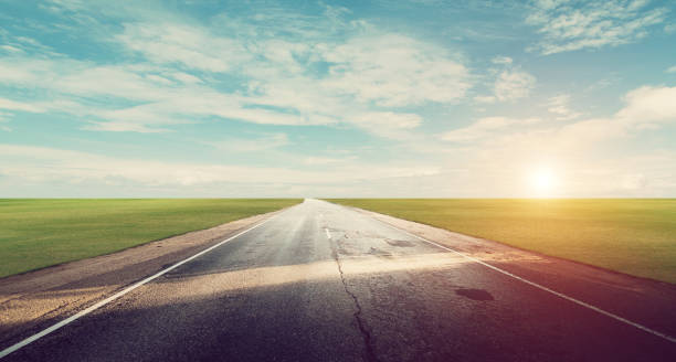istock Panoramic road sunrise summer travel 1094367396