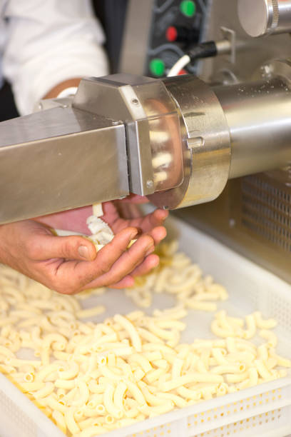 istock Pasta machine with chef hands holding the freshly made pasta 1094371604