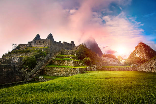 View of the stone ruins Machu Picchu at sunrise View of the stone ruins Machu Picchu at sunrise. In the background Huayna Picchu mountain in the clouds. Machu Picchu is located in the Cusco region in Peru machu picchu photos stock pictures, royalty-free photos & images