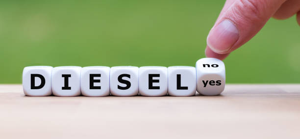 istock Should diesel engines be banned? Hand turns a dice and changes the word 