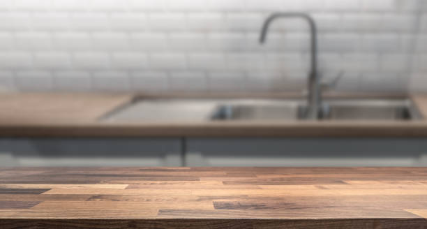 istock Kitchen island with wooden table top for product display montage. 1094383800
