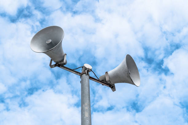 istock Loudspeakers on sky background 1094389800