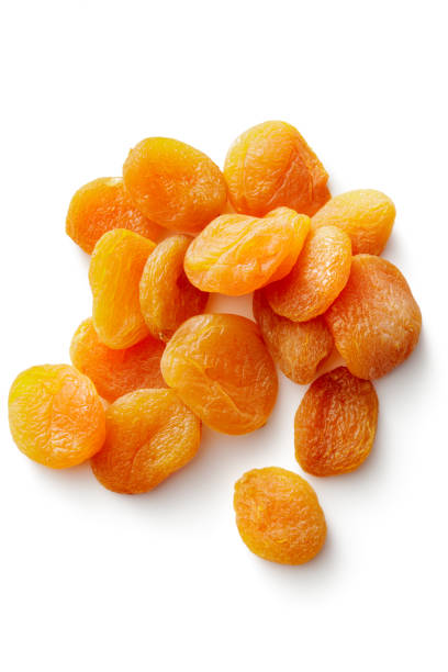nüsse: getrocknete aprikosen, isolated on white background - dried apricot stock-fotos und bilder