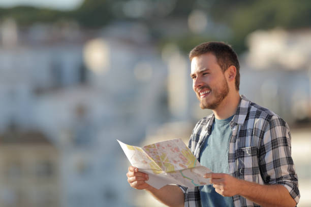 istock Happy tourist sightseeing in a town on vacation 1094391726