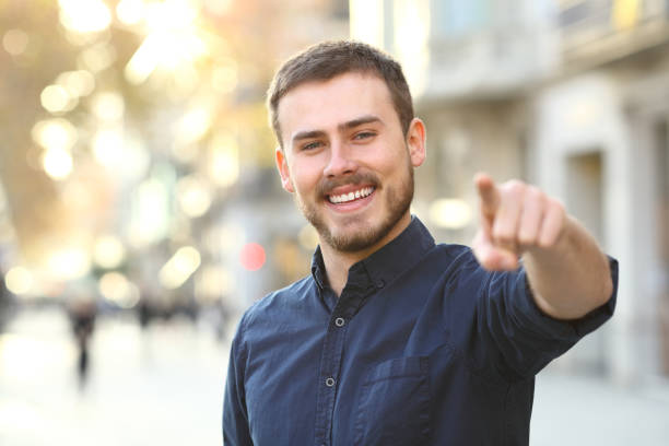 istock Happy man in the street pointing at camera 1094392176