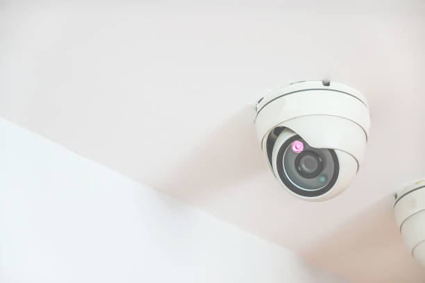 istock Security, CCTV Camera hanging on the roof in the condo 1094393500
