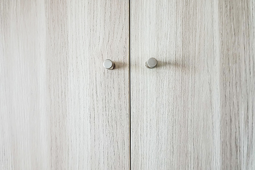 close-up of doors of wooden wardrobe, wood textures