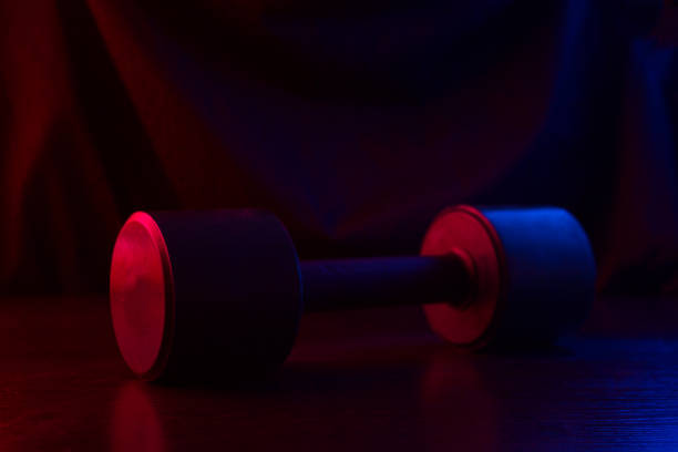 istock metal barbell on dark background 1094396784