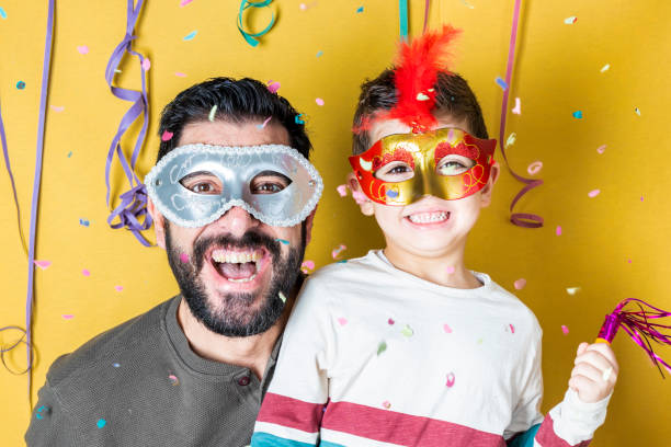 istock Father and son celebrating Carnival with masks 1094400002