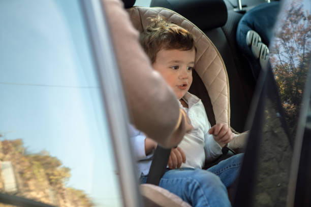 istock Boy seating on car seat 1094400060