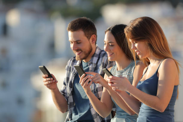 istock Group of friends using their smart phones 1094401722