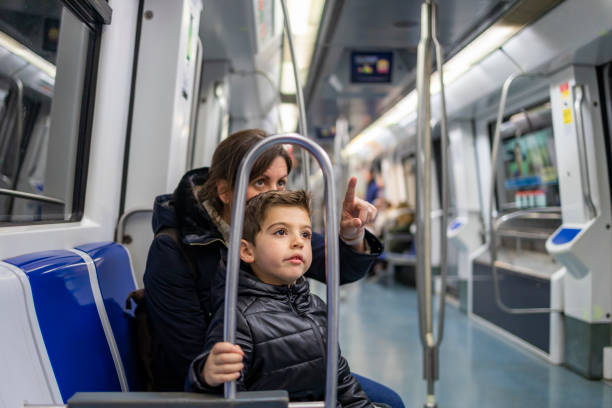 Mother and son travelling on the subway