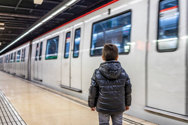 istock Little boy waiting the train on the subway 1094402126