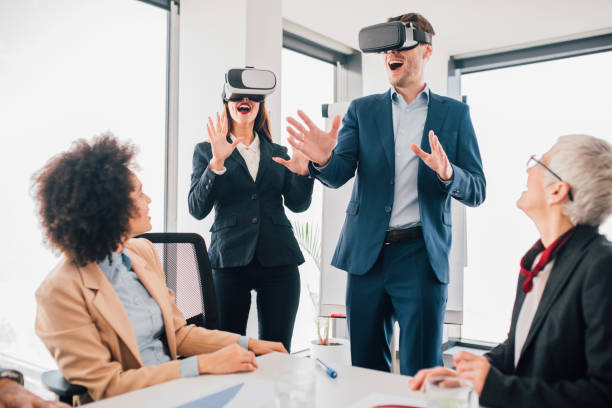 istock Happy people wearing virtual reality glasses 1094402664