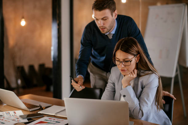 istock Young colleagues sitting together and working in the office 1094411168