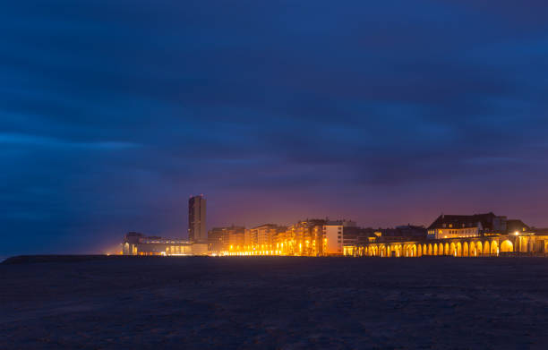 The urban skyline of Ostend at night, Belgium.