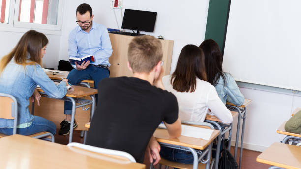 istock Male teacher giving lecture for students 1094413334