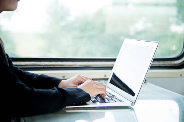 istock Businesswoman on train using laptop 1094414846