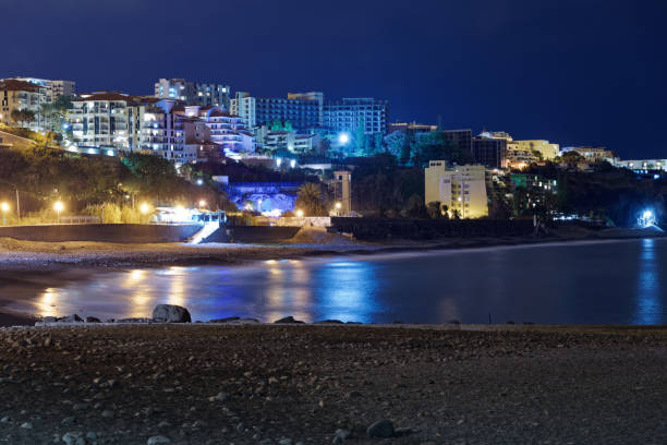 istock Panoramic view at the beach Praia Formosa at night 1094415034