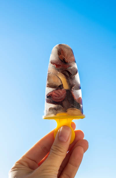 istock Popsicle ice cream with flower petals 1094416668