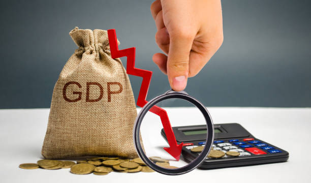 Money bag with the word GDP and down arrow. Decline and decrease of GDP - failure and breakdown of economy and finances leading to financial crisis and trouble. Drop in gross domestic product stock photo