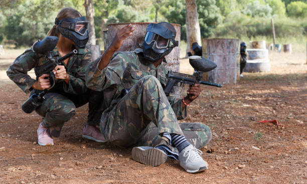 istock Teams facing in paintball arena 1094419506