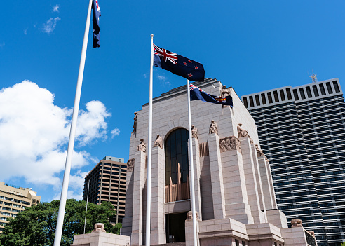 Exterior view of Anzac memorial in Sydney Australia with Australian NSW and New Zealand flag in the front