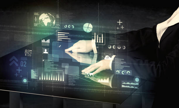 istock Businessman touching interactive modern desk with technology icons 1094420834