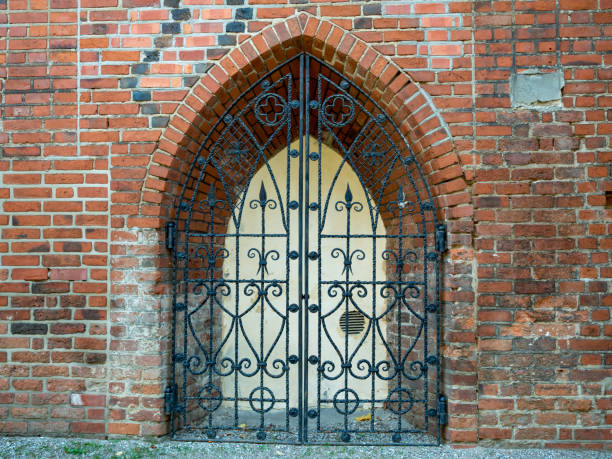 View of a gothic brick window with metal decoration