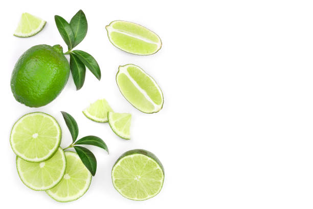 istock sliced lime vith leaves isolated on white background with copy space for your text. Top view. Flat lay pattern 1094426150
