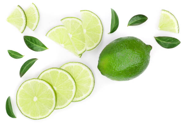 istock sliced lime vith leaves isolated on white background with copy space for your text. Top view. Flat lay pattern 1094426152