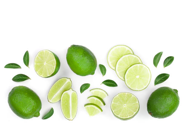 istock sliced lime vith leaves isolated on white background with copy space for your text. Top view. Flat lay pattern 1094426192