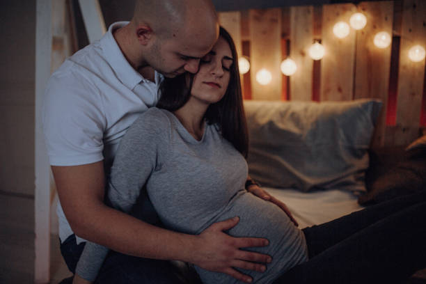 istock Pregnant Mom and her Husband at home 1094426538