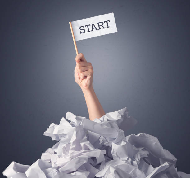 istock Female hand holding start sign 1094427496