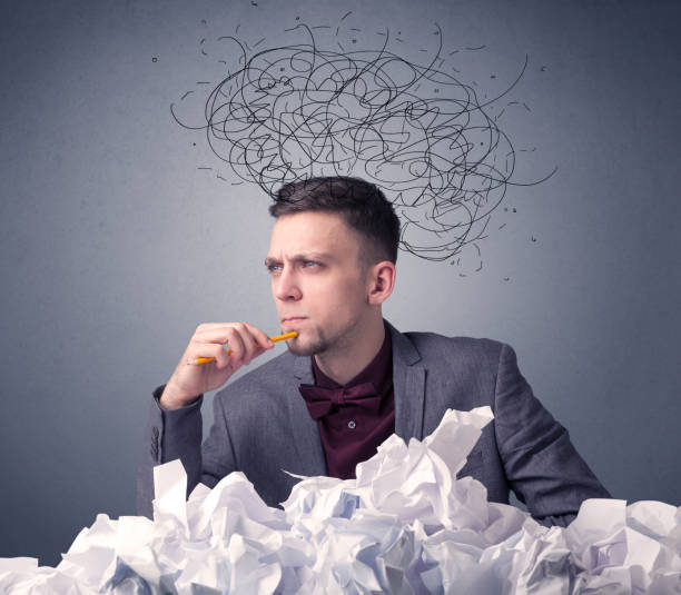 istock Businessman above crumpled paper 1094429668