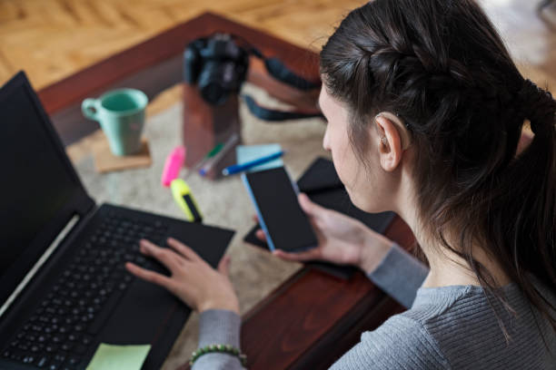 Young woman designer working at home