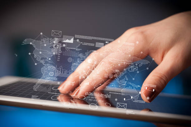 istock Fingers touching tablet with charts 1094438732