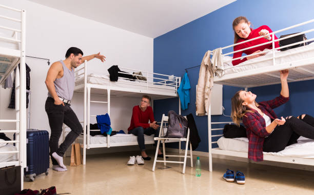 istock Travelers communicating in hostel bedroom 1094440624