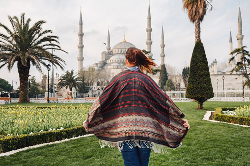 Woman enjoy beautiful view on Sultanahmet Blue Mosque , famous islamic Landmark mosque, Travel to Istanbul, Turkey