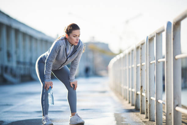 istock Young woman exercising outdoors 1094442872