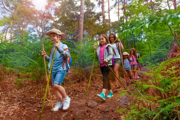 istock Group of kids walk in the forest during hiking 1094443598