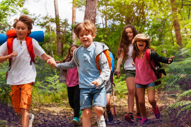 istock Children running in the forest together hold hands 1094444800