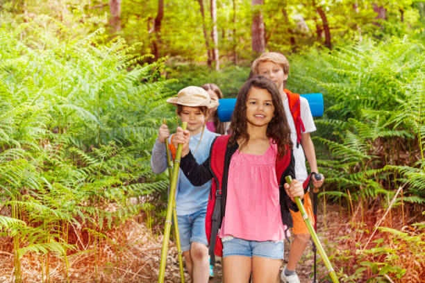 istock Portrait of kids hiking as class group in forest 1094444830