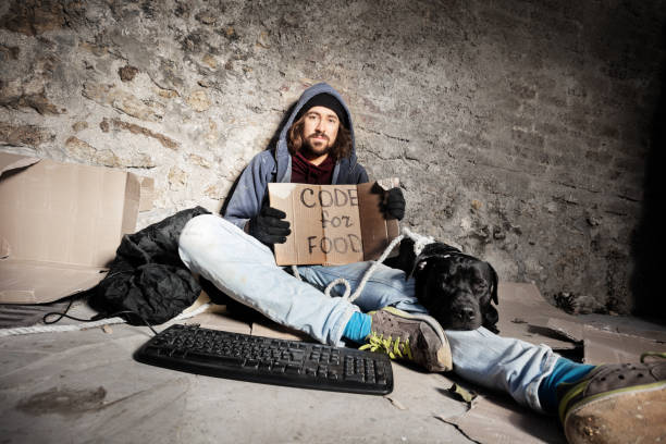 istock Jobless man sitting on city sidewalk with his dog 1094446882