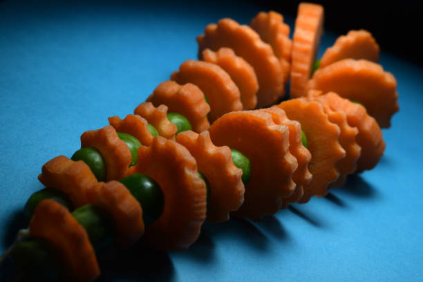 Craft made from Carrot and Green Pea as necklace