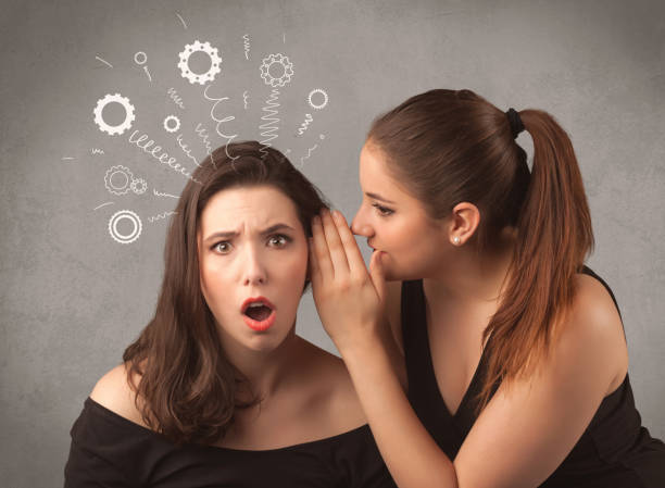 istock girl telling secret things to her girlfriend 1094450016
