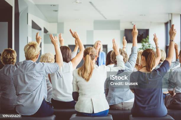 Audience Voting During Seminar Stock Photo - Download Image Now - Voting, Meeting, Hand Raised